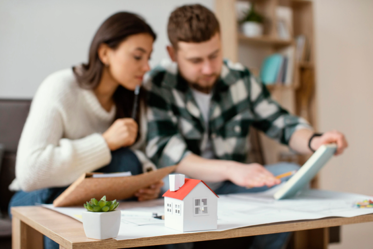a couple looking at some legal documents in preparation for their home purchase in NSW
