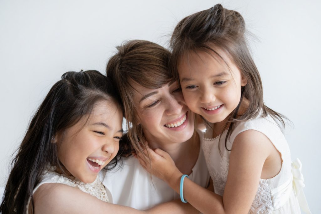 an-image-of-a-divorced-mother-laughing-with-her-daughters