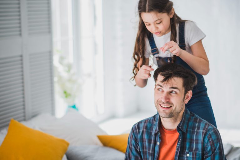 an-image-of-a-young-girl-playing-with-her-fathers-hair-after-a-smooth-divorce-process-in-nsw